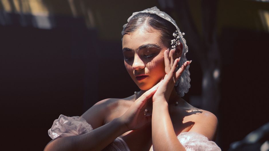 A serene bride in soft lighting, expressing elegance and tranquility in a portrait setting.